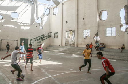Boys playing football in a bombed out gym in Gaza. From a series of photos commissioned by British NGO, Medical Aid for Palestine (2014)
