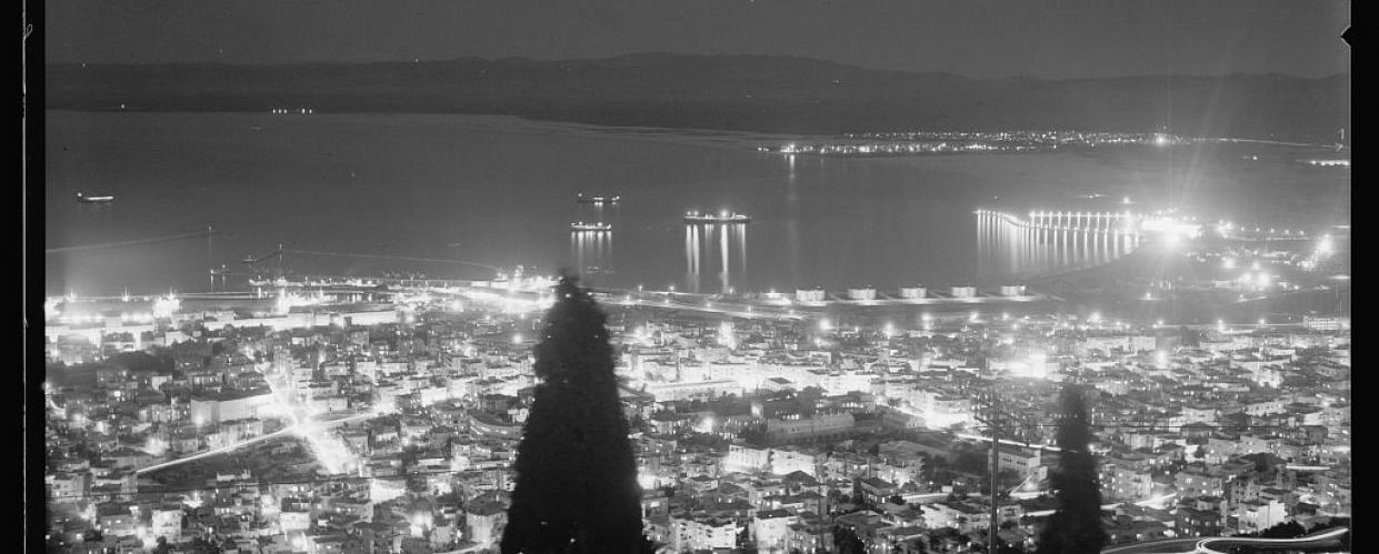 Haifa night view, from Mount Carmel, showing lights in Acre across the bay, 1934-1939. American Colony Photo Department, Matson Collection, Library of Congress. https://www.loc.gov/resource/matpc.22390/. 