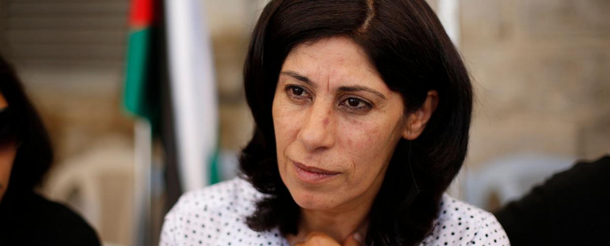 Khalida Jarrar speaks at her protest tent erected outside the headquarters of the Palestinian parliament in Ramallah on August 21, 2014. 